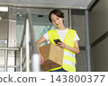 Female delivery driver 143800377