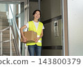 Female delivery driver 143800379