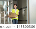 Female delivery driver 143800380