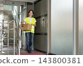 Female delivery driver 143800381
