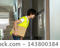 Female delivery driver 143800384