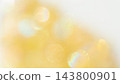 A background with yellow light bokeh and a beautiful, sparkling gradient. 143800901