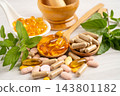 Alternative medicine herbal organic capsule with vitamin E omega 3 fish oil, mineral, drug with herbs leaf natural supplements for healthy good life. 143801182