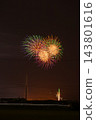 A compact triple-barreled fireworks display illuminating the summer night sky: A scene from the Mori Town Summer Fireworks Festival (vertical orientation, 2:3 aspect ratio) (Shizuoka Prefecture) 143801616