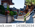 Traditional Korean Hanok Houses and Tiled Roofs against Bukhansan Mountain in Eunpyeong Hanok Village, Seoul 143802034