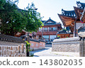 Traditional Korean Hanok Houses and Tiled Roofs against Bukhansan Mountain in Eunpyeong Hanok Village, Seoul 143802035