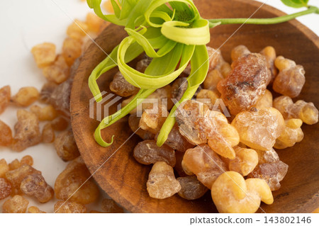 Frankincense or olibanum aromatic resin isolated on white background used in incense and perfumes. 143802146