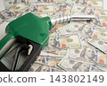 Gas pump, Fuel Nozzle with dollar money for cost energy. 143802149