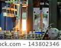 PET bottles mass production operation coming out of a blow molding machine 143802346