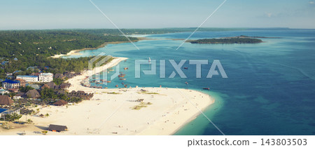 Aerial view of Kendwa village green ocean and sandy beach in Zanzibar Aerial view of Kendwa village green ocean and sandy beach in Zanzibar 143803503