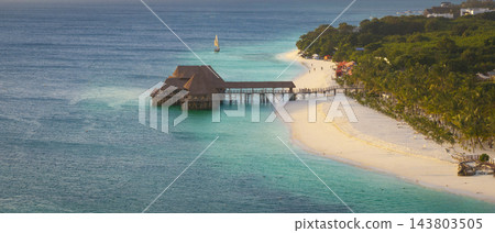 Aerial view of beautiful bungalow restaurant green ocean and sandy beach Aerial view of beautiful bungalow restaurant green ocean and sandy beach 143803505