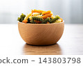 Dry tricolor fusilli pasta in bowl 143803798