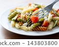 Colorful fusilli pasta salad with fresh vegetables and feta cheese 143803800