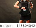 woman evening dress with black fan in hand 143804042