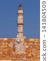 Historic Venetian Lighthouse Behind Stone Wall in Chania, Crete, Greece 143804509