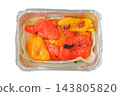 Grilled peppers in a metal container, isolated on a white background. Takeaway food. Street food and outdoor cooking. Top view. 143805820