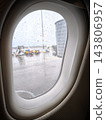 Raindrops on an airplane window at the airport 143806957