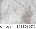 Soft light and a wrinkled white fabric background texture 143808078