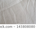 Soft light and a wrinkled white fabric background texture 143808080