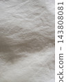 Soft light and a wrinkled white fabric background texture 143808081