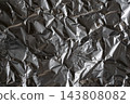 Crumpled aluminum foil metallic background texture 143808082