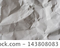 A crumpled white background texture that highlights wrinkles and dents. 143808083