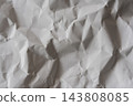 A crumpled white background texture that highlights wrinkles and dents. 143808085