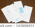 Bills envelopes pile 143808453