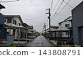 Rain-soaked roads and detached houses in a residential area 143808791