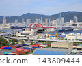 The luxury cruise ship "Luminara," operated by The Ritz-Carlton Yacht Collection, is currently docked at Kobe Port. 143809444