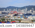 The luxury cruise ship "Luminara," operated by The Ritz-Carlton Yacht Collection, is currently docked at Kobe Port. 143809447
