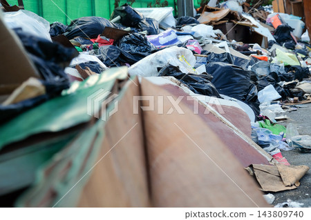 Pile of garbage and plastic waste on the ground 143809740
