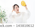 A woman worried about money, carrying a coin purse. 143810612