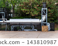 Large Metal-Clad Pipe with a Vertical Bend and Steel Supports 143810987