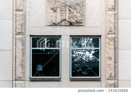 Two Windows in a Pale Stone Wall with Rough and Smooth Panels Two Windows in a Pale Stone Wall with Rough and Smooth Panels 143810988
