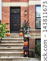 Halloween Pumpkins and Skeleton Decorations on Brick House Steps 143811673