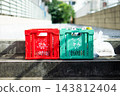 Recycling containers for bottles and cans installed on the street. 143812404