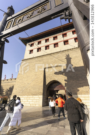 Xi'an, China - Dec 30, 2024 : The towers and city wall of of the south gate of Xi'an, China in Dec 30, 2024. Xi'an, China - Dec 30, 2024 : The towers and city wall of of the south gate of Xi'an, China in Dec 30, 2024. 143812966