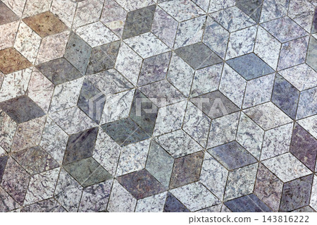 Geometric stone floor featuring a three dimensional cube pattern Geometric stone floor featuring a three dimensional cube pattern 143816222