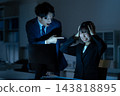Male and female businessmen working overtime in the office 143818895