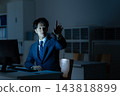 A businessman who works overtime in the office 143818899
