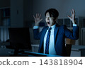 A businessman who works overtime in the office 143818904