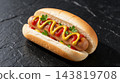 Delicious hotdog with mustard and ketchup on background 143819708