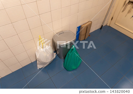 Top-down view of two tied trash bags Top-down view of two tied trash bags 143820040
