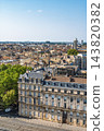 Aerial view of Bordeaux historic city center showing traditional stone architecture and dense urban rooftops beneath a clear summer sky over the 143820382