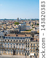 Aerial view of the historic city center of Bordeaux in France showing traditional stone architecture and rooftops under a clear bright summer sky 143820383