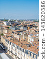 Aerial view of the historic city center of Bordeaux in France featuring traditional architecture and rooftops under a bright clear blue summer sky 143820386