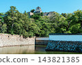 Marugame Castle: Stone walls of the inner moat and the castle tower Marugame Castle: Stone walls of the inner moat and the castle tower 143821385