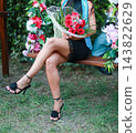 Woman In Black Heels Holding Bouquet 143822629
