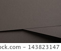 Grey paper texture, overlapping sheets with diagonal fold and crease. Charcoal matte surface close up, folded sheet with fine grain and edge line. Monochrome backdrop, minimalistic designer 143823147